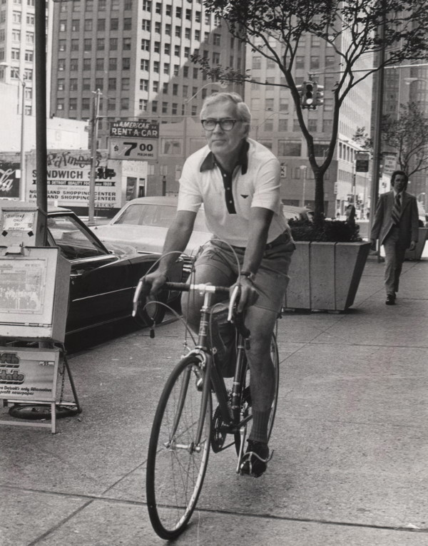 Eugene Sloane on Sidewalk with Teledyne Titan Bike
